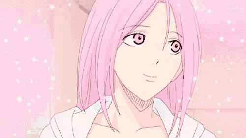 a girl with pink hair is smiling and looking at the camera while wearing a white shirt .