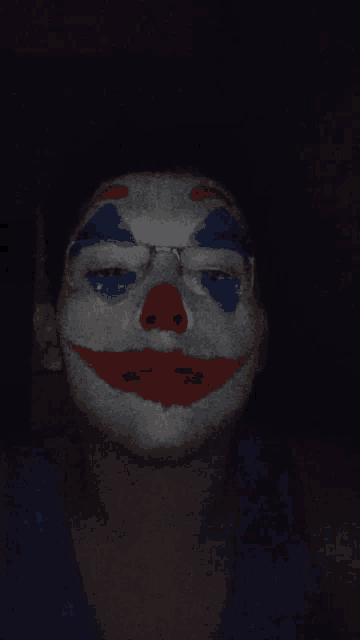 a person with clown makeup on their face