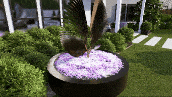 a statue of a bird with purple flowers in a black planter