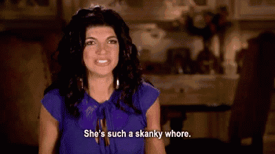 a woman in a blue shirt is talking about a woman in a purple shirt .