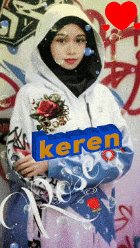 a girl wearing a hoodie with the word keren on the front