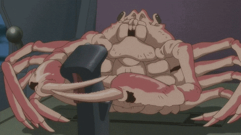 a crab with a hammer in its mouth