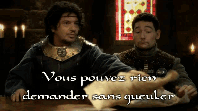two men sitting at a table with the words " vous pouvez rien demander sans queuler "