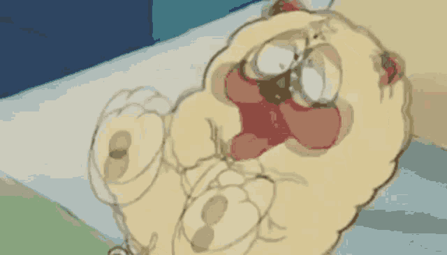 a cartoon cat is laying on a bed with its mouth open and making a funny face .