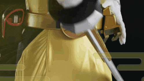 a close up of a person holding a sword and a belt with the letter ii on it