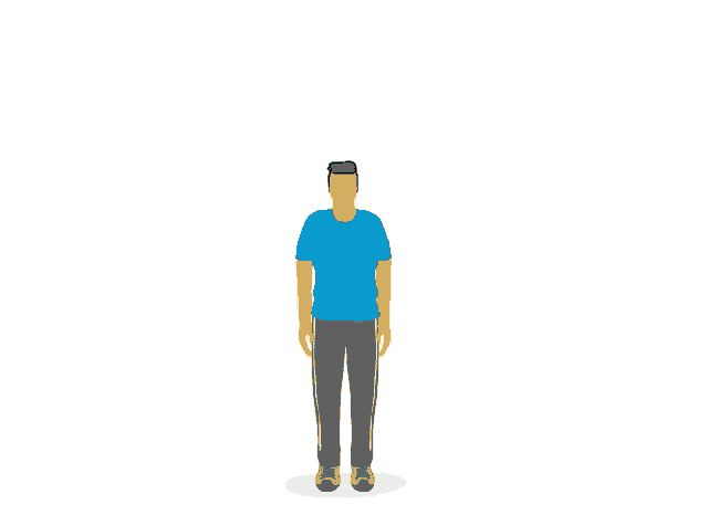 a man in a blue shirt and grey pants is jumping in the air with his arms outstretched