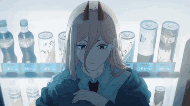 a girl with horns is sitting in front of a vending machine that sells coca cola