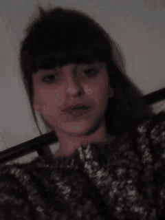 a close up of a woman making a funny face with her lips .