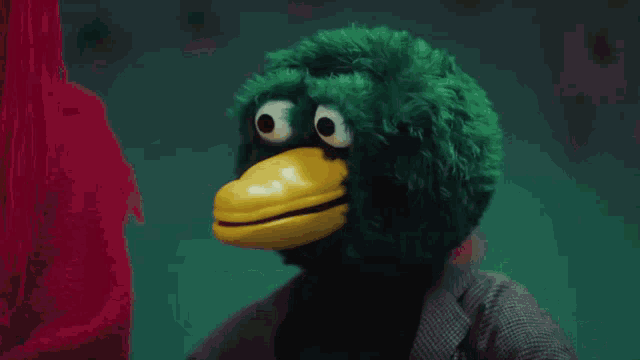 a green bird with a yellow beak says " i don t want people going around saying we 're not online "
