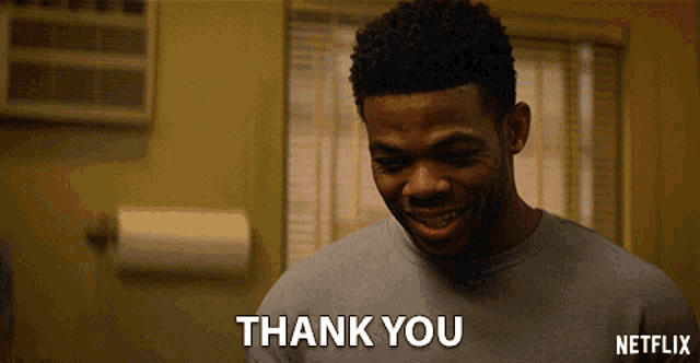 a man in a grey shirt says thank you in a netflix ad