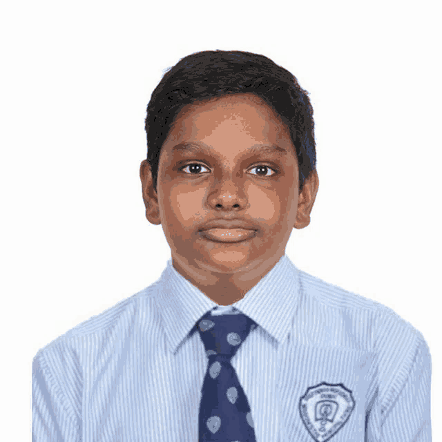 a young boy wearing a striped shirt and tie has a badge on his chest that says ' chennai '