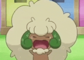a cartoon sheep with green ears is crying with its mouth wide open .