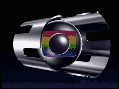 a rainbow colored ball is in the center of a silver ring