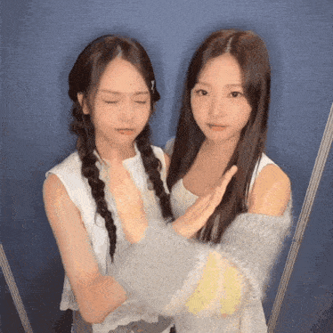 two girls are standing next to each other and one has a piercing in her lip