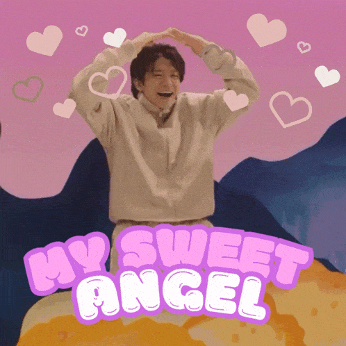 a man making a heart shape with his hands and the words my sweet angel behind him