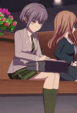 a girl sitting on a bench with a briefcase on her lap
