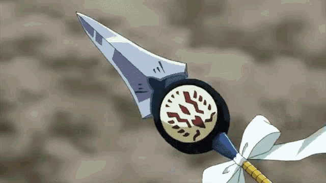 a cartoon drawing of a spear with a white bow