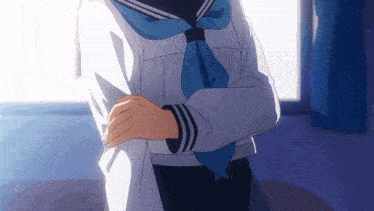 a girl with her arms crossed is wearing a blue tie