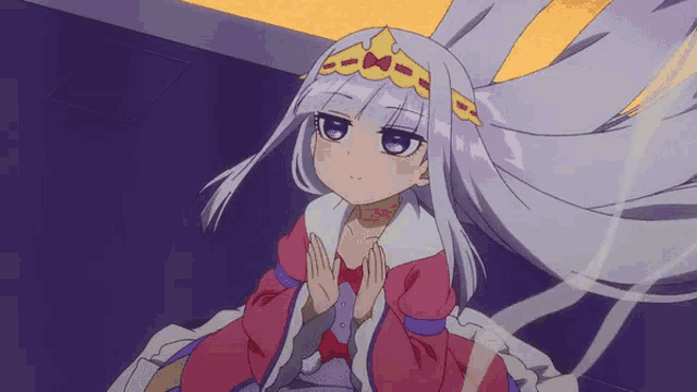 a girl with a crown on her head is sitting down