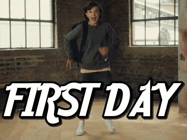 a girl with a backpack is dancing in front of a sign that reads first day
