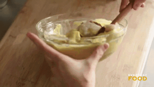 a person is mixing something in a bowl with a wooden spoon and the words everyday food on the bottom