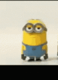 a couple of minions standing next to each other on a white surface