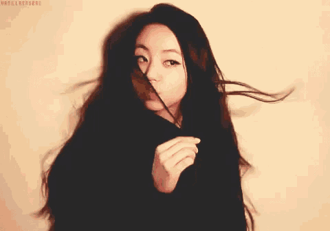 a woman 's hair is blowing in the wind and the words vanilla heroes are visible on the bottom right