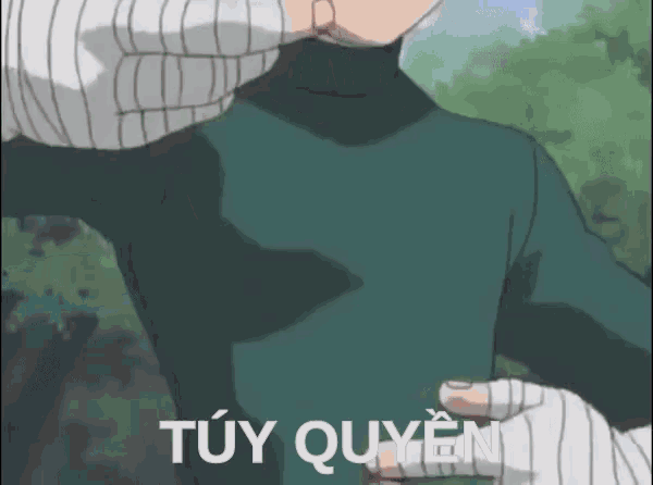 a man in a green turtleneck sweater is being kissed by a person in white gloves .