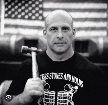 a man wearing a shirt that says ters stones and molds
