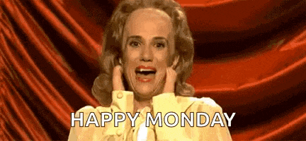 a woman in a yellow dress is making a funny face and saying `` happy monday '' .