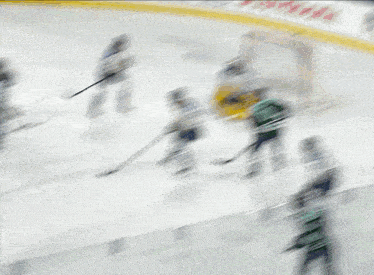 a hockey game is being played in front of a scotiabank advertisement