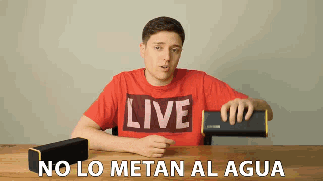 a man in a red shirt that says live on it