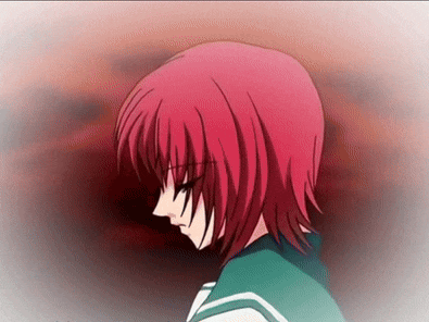 a girl with red hair is looking down with a red background