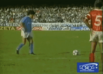 a soccer player with the number 5 on his back is kicking a ball