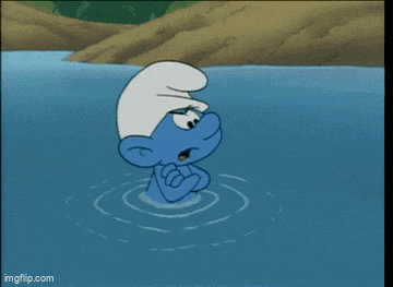 a smurf is standing in a body of water with his arms crossed ..
