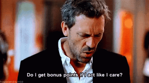 a man in a suit and white shirt says do i get bonus points if i act like i care .