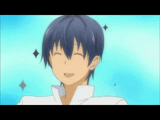 a man with blue hair is smiling with a diamond on his head