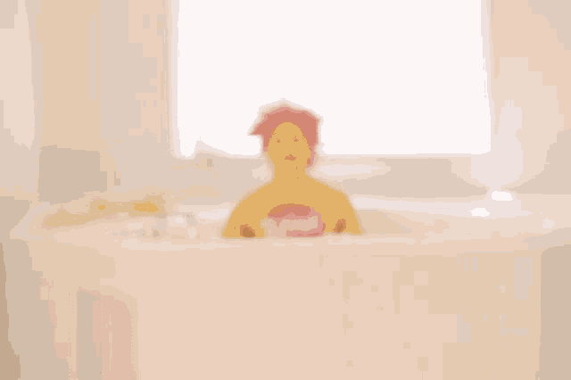 a man in a bathtub with a shirt that says totino 's on it