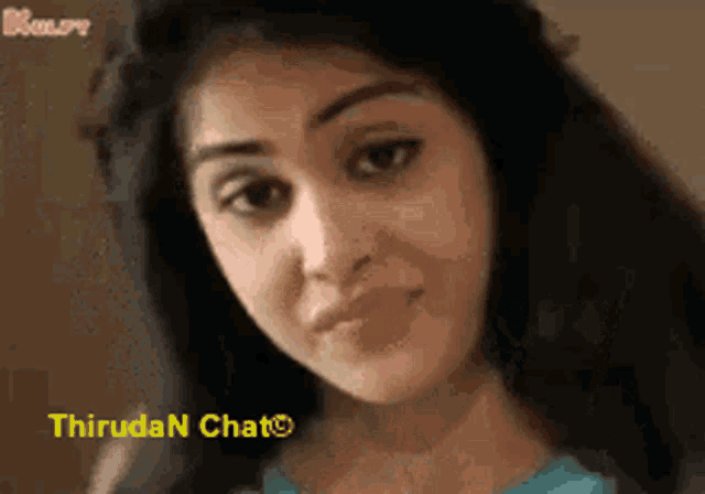 a close up of a woman 's face with the words thiruda n chat visible