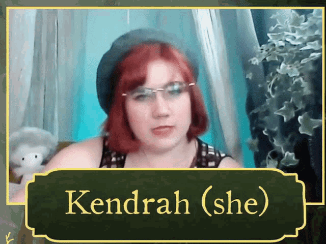 a woman with red hair and glasses is named kendrah
