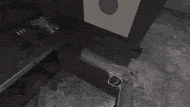 a gun is being fired at a target and the word bang is visible in the corner