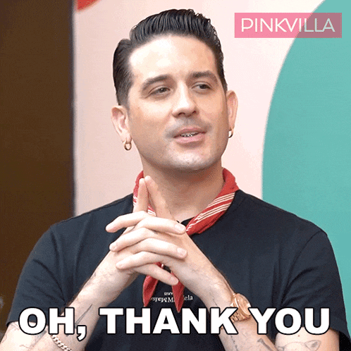 a man wearing a black shirt and a red scarf says " oh thank you "
