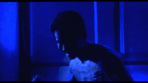 a close up of a person 's eyes in a dark room