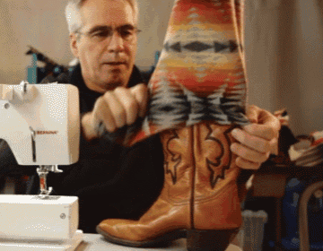 a man is sewing a pair of cowboy boots using a sewing machine made by bernina