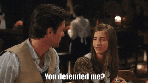 a man and a girl are sitting at a table and the girl asks the man if he defended her