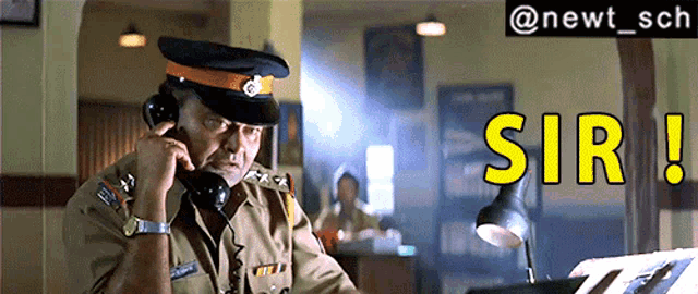 a man in a police uniform is talking on a phone and the words sir are visible