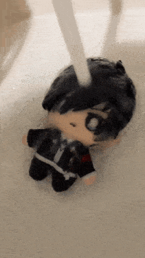 a stuffed doll is being washed in a sink with water coming out of it