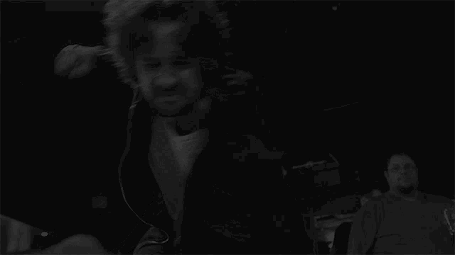 a black and white photo of a person dancing