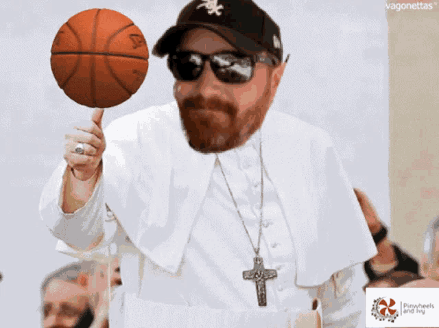 a man in a white robe is holding a basketball on a stick