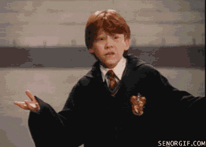 a boy in a gryffindor uniform is making a gesture